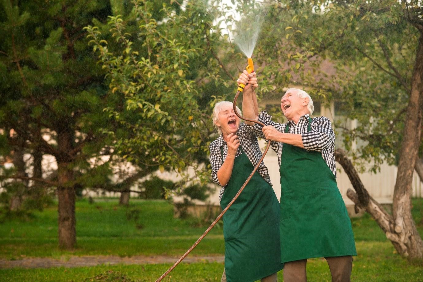 senior couple having fun in the garden
